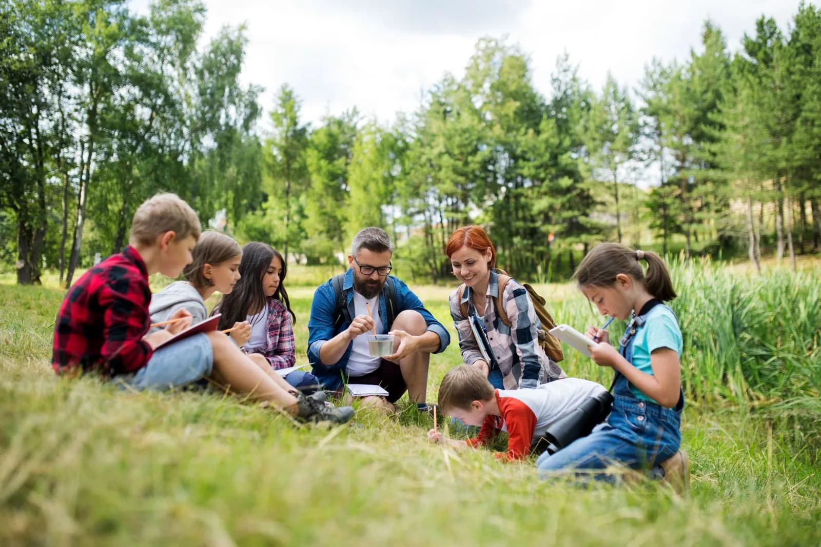 A teacher leading a group of school children on a field trip