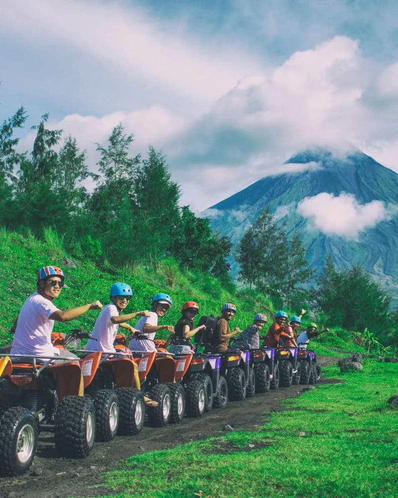 A line of riders on all-terrain vehicles on a group adventure